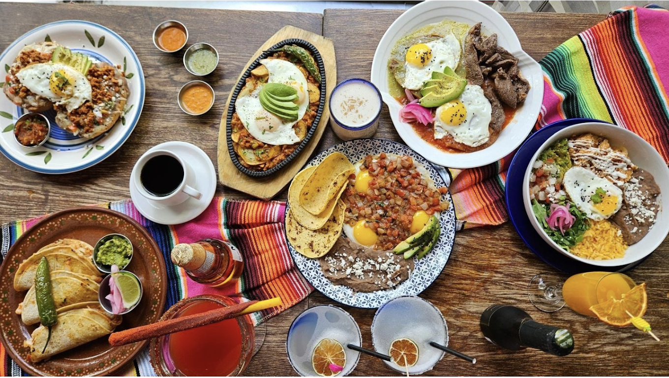 Brunch spread on the patio with eggs, salsas and cocktails