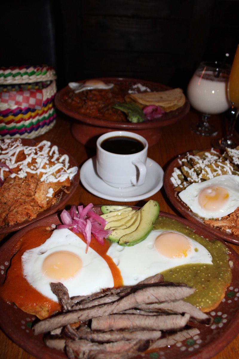 Steak Ranchero with top sirloin in Mexican sauce, fried egg, avocado and refried beans