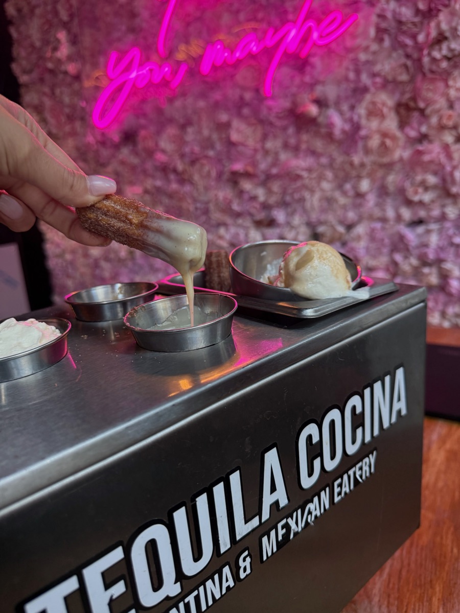 Churros with chocolate, dulce de leche and ice cream on a Tequila Cocina branded tray
