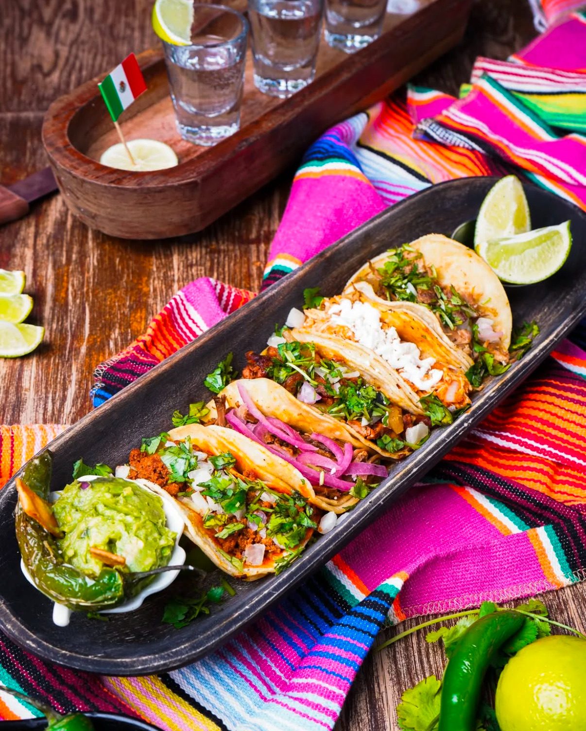 Tequila Cocina meat tacos with melted cheese, cilantro and onion