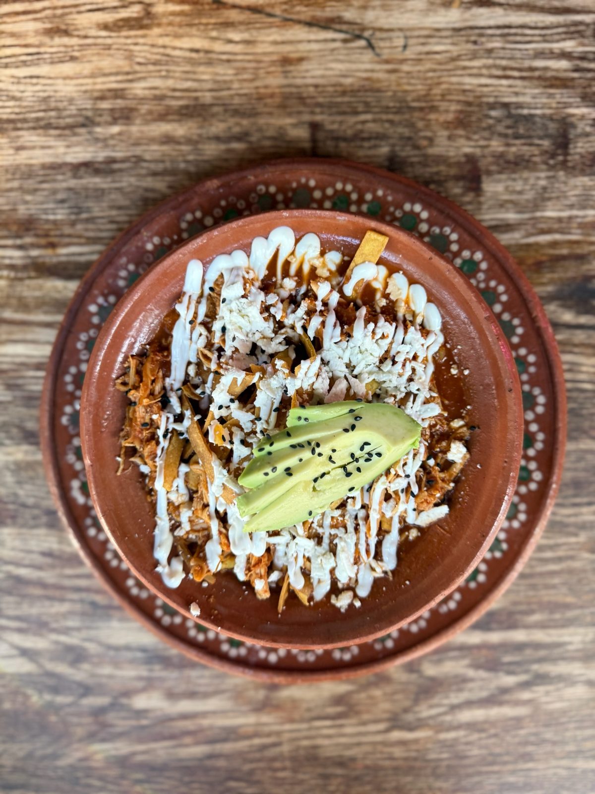 Sopa de Tortilla with sour cream, avocado and crispy strips