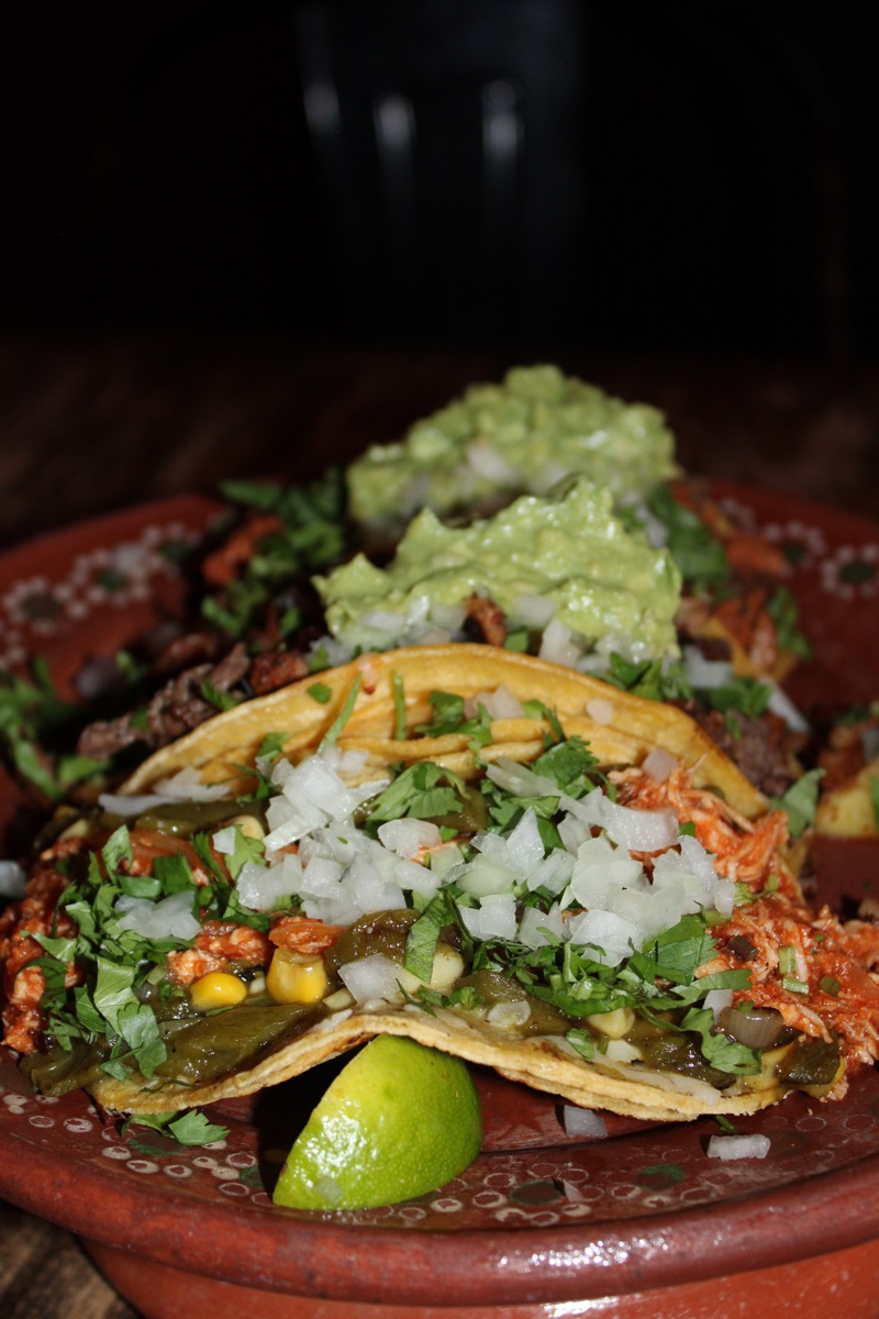 Mixed tacos with guacamole and pico for a watch party