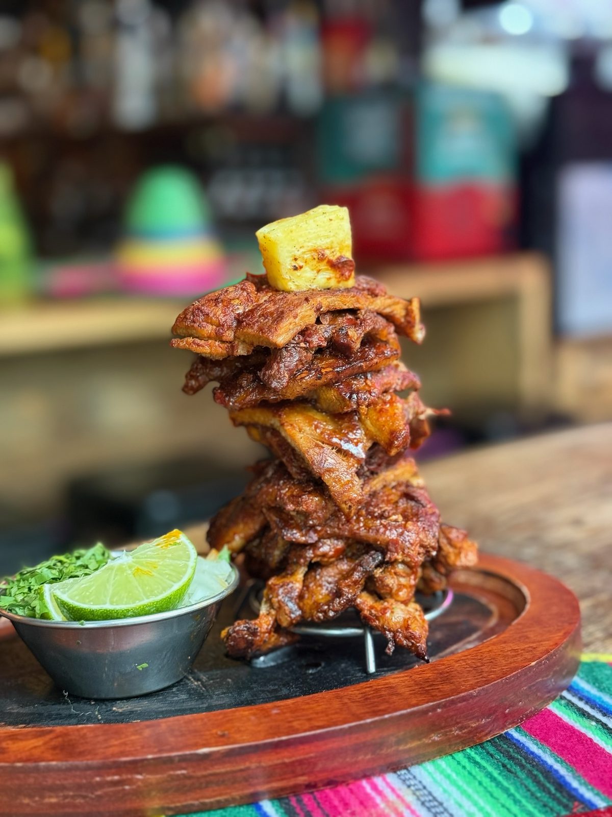Tower of al pastor pork served at Tequila Cocina